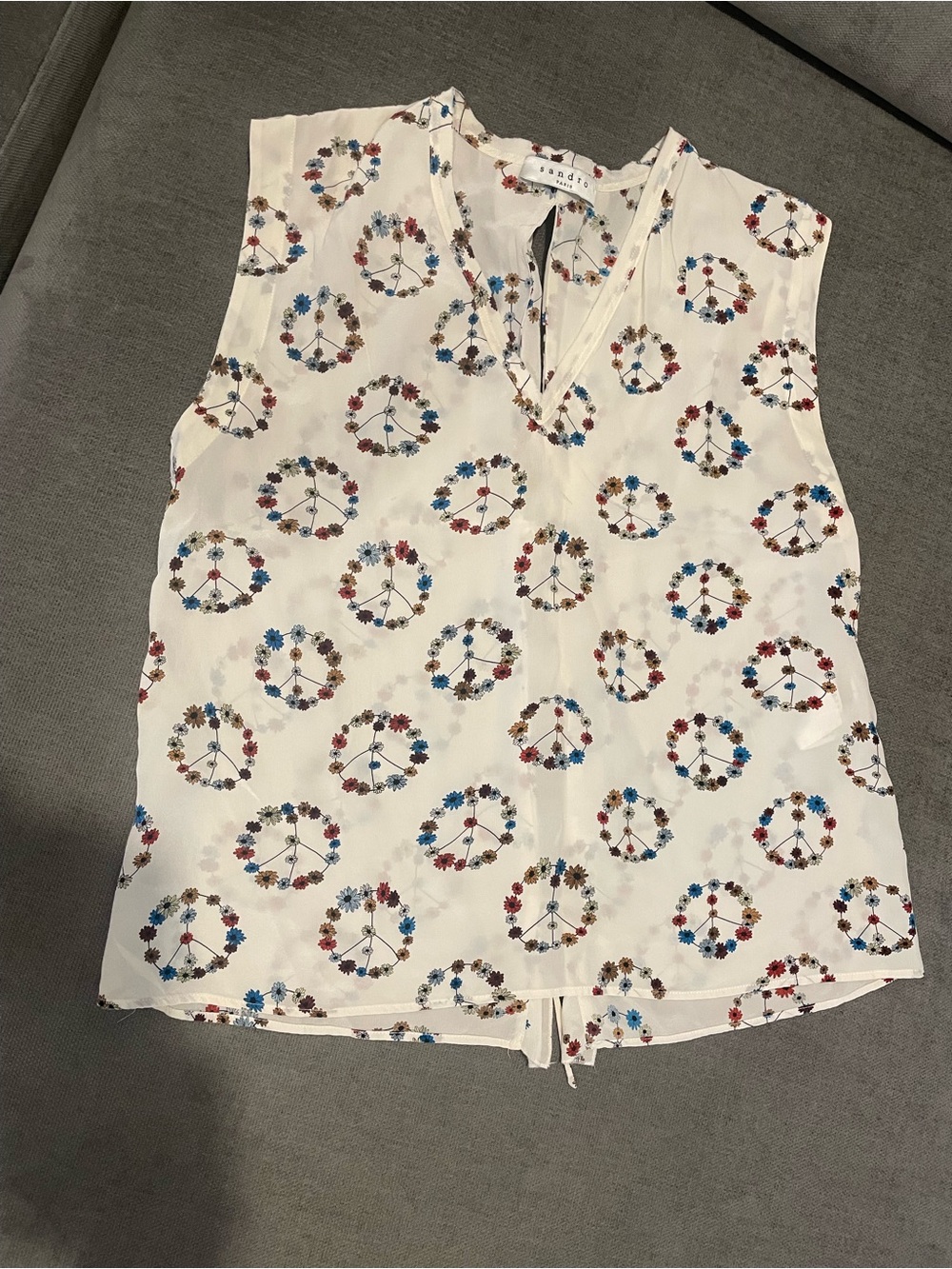 Sandro Cream Sleeveless V-Neck Top with Multicolor Floral Peace Sign Print